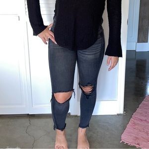 Black jeans with distress and side stripe